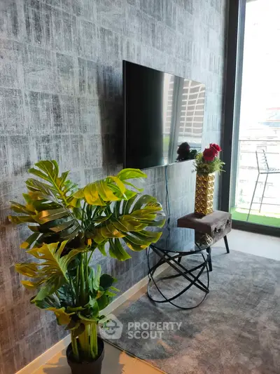 Modern living room with wall-mounted TV and stylish decor