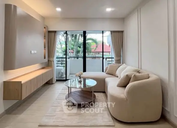 Modern living room with elegant furniture and balcony view
