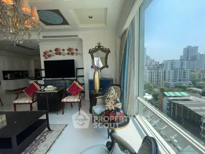 Luxurious living room with elegant decor and stunning city view through large windows.
