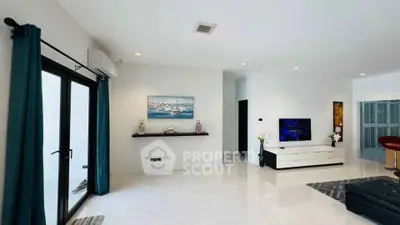 Spacious modern living room with sleek decor and natural light