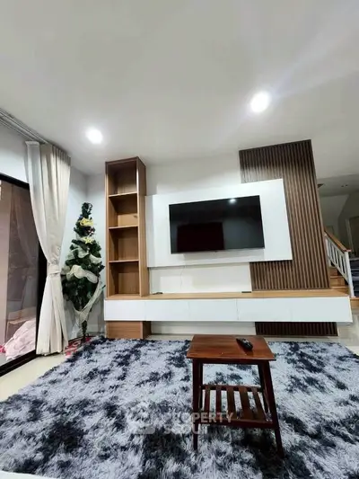 Modern living room with stylish decor and entertainment center