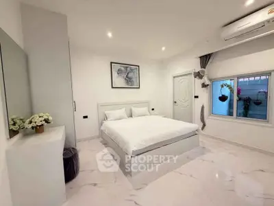 Modern minimalist bedroom with white decor and large window view