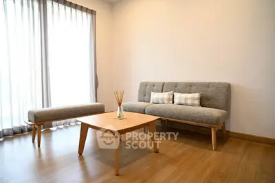 Modern minimalist living room with wooden floor and stylish furniture