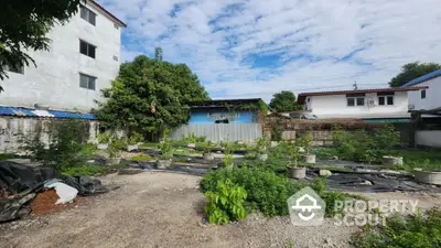 Spacious urban garden plot with potential for development in residential area.