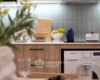 Modern kitchen with sleek appliances and stylish backsplash