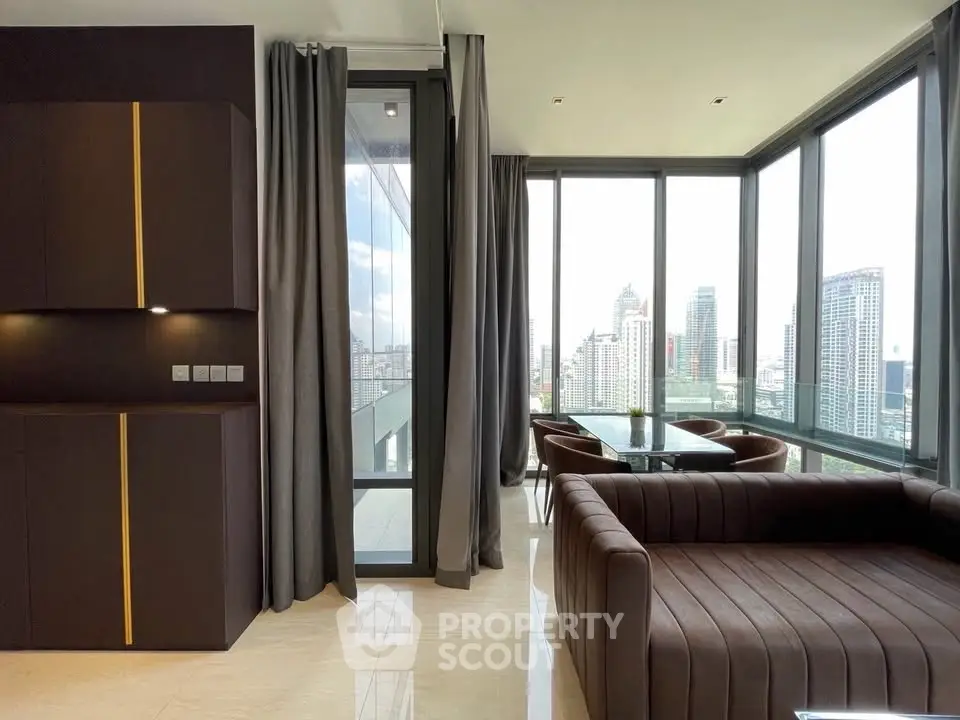 Luxurious corner unit living room with panoramic city views and modern furnishings.