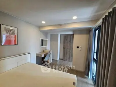 Modern bedroom with stylish decor and natural light