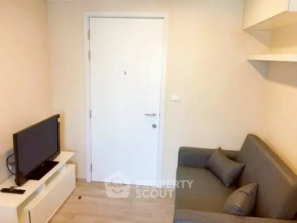 Cozy living room with modern sofa and TV setup