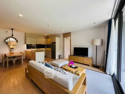 Spacious modern living room with open kitchen and elegant decor