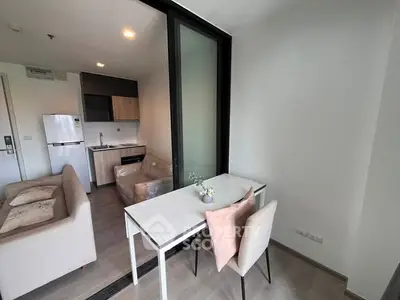 Modern apartment interior with cozy living area and compact kitchen