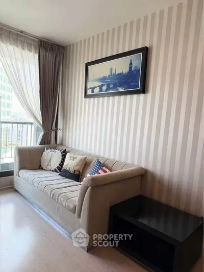 Stylish living room with cozy sofa and elegant decor in modern apartment.