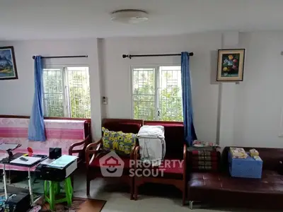 Cozy living room with natural light and comfortable seating