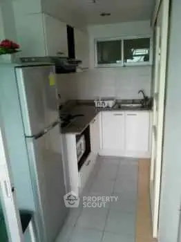 Compact modern kitchen with sleek appliances and efficient layout