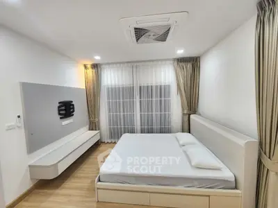 Modern minimalist bedroom with sleek design and natural light