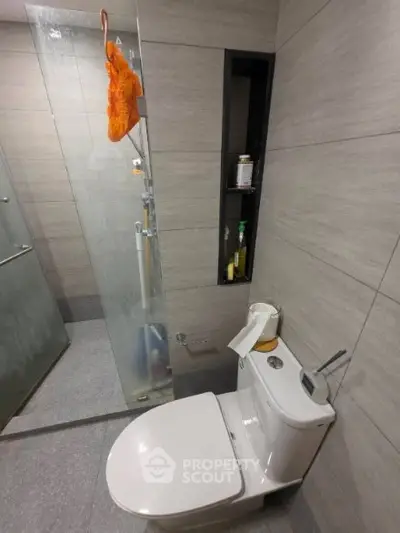 Modern bathroom with sleek design and glass shower enclosure