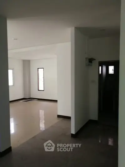 Spacious interior with natural light and minimalist design, ideal for modern living.