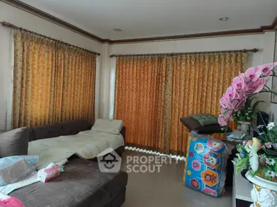 Cozy living room with elegant curtains and comfortable seating area