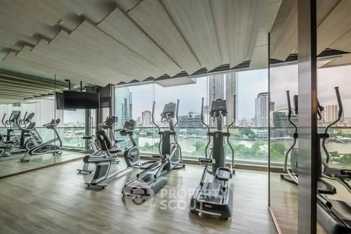 Modern gym with city view and state-of-the-art equipment in luxury high-rise building.