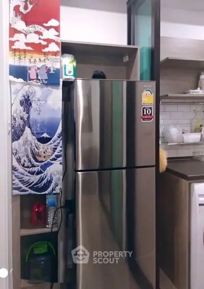 Modern kitchen with stainless steel fridge and stylish decor