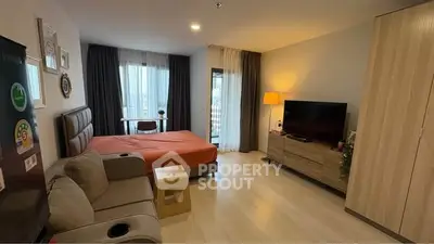 Modern studio apartment with cozy living area and stylish decor