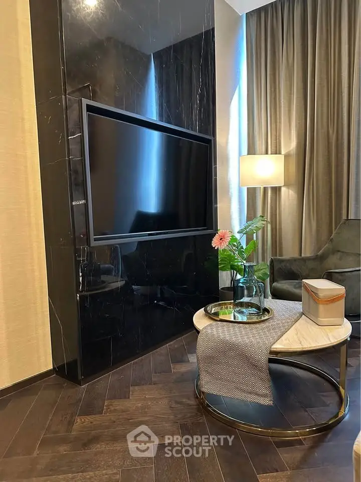 Luxurious living room with sleek black marble TV wall and elegant decor
