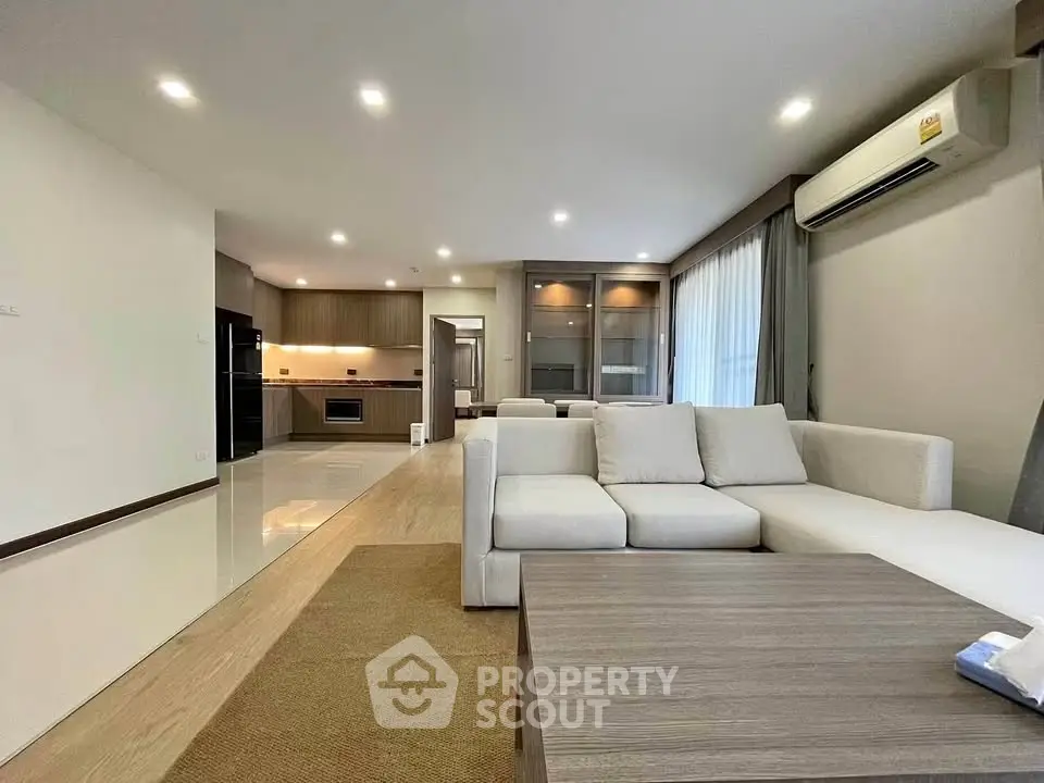 Spacious modern living room with open kitchen and elegant decor