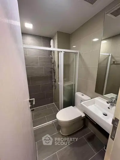 Modern bathroom with sleek shower and contemporary fixtures