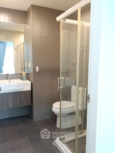 Modern bathroom with glass shower and sleek fixtures