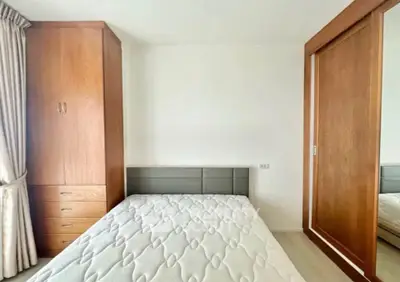 Spacious bedroom with built-in wardrobe and natural light