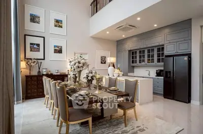 Luxurious dining area with elegant decor and modern kitchen in open layout