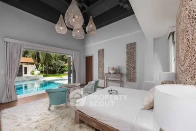 Luxurious bedroom with pool view and elegant decor in modern villa
