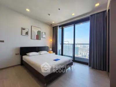 Modern bedroom with stunning city view and large windows