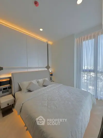 Luxurious bedroom with modern design and natural light in high-rise apartment