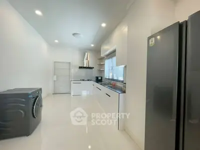 Modern kitchen with sleek appliances and minimalist design