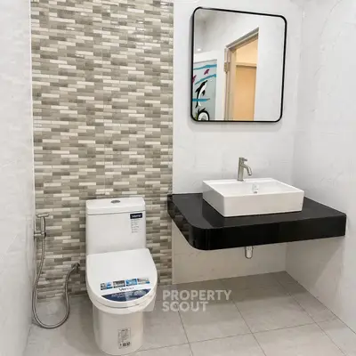 Modern bathroom with sleek fixtures and stylish tile design