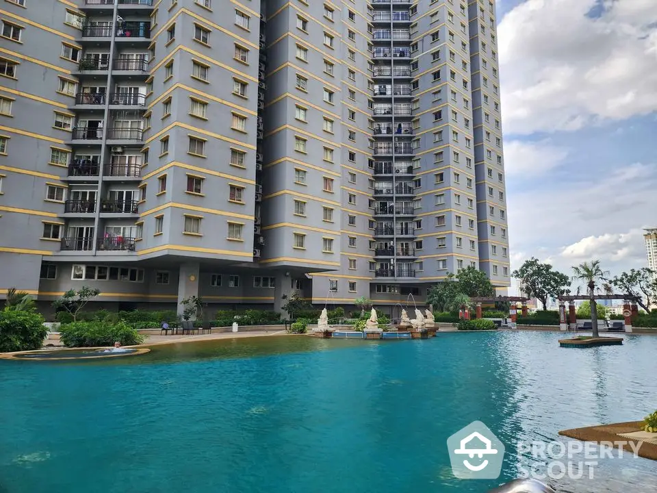 Luxurious high-rise apartment with stunning pool view and lush greenery