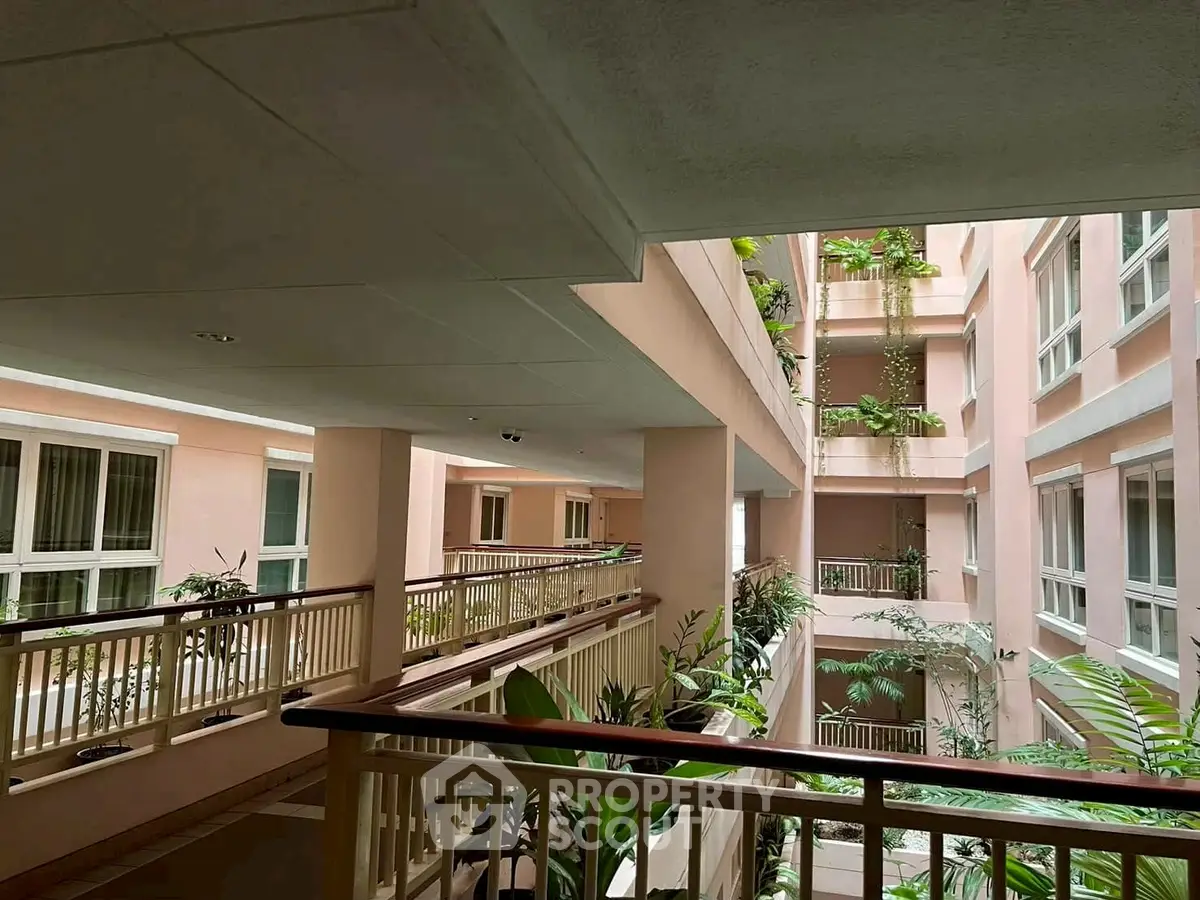 Elegant building interior with lush greenery and natural light