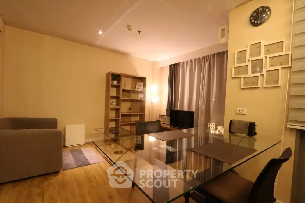 Modern living room with glass dining table and cozy lighting