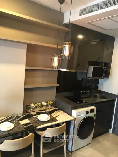 Modern compact kitchen with dining area and washing machine