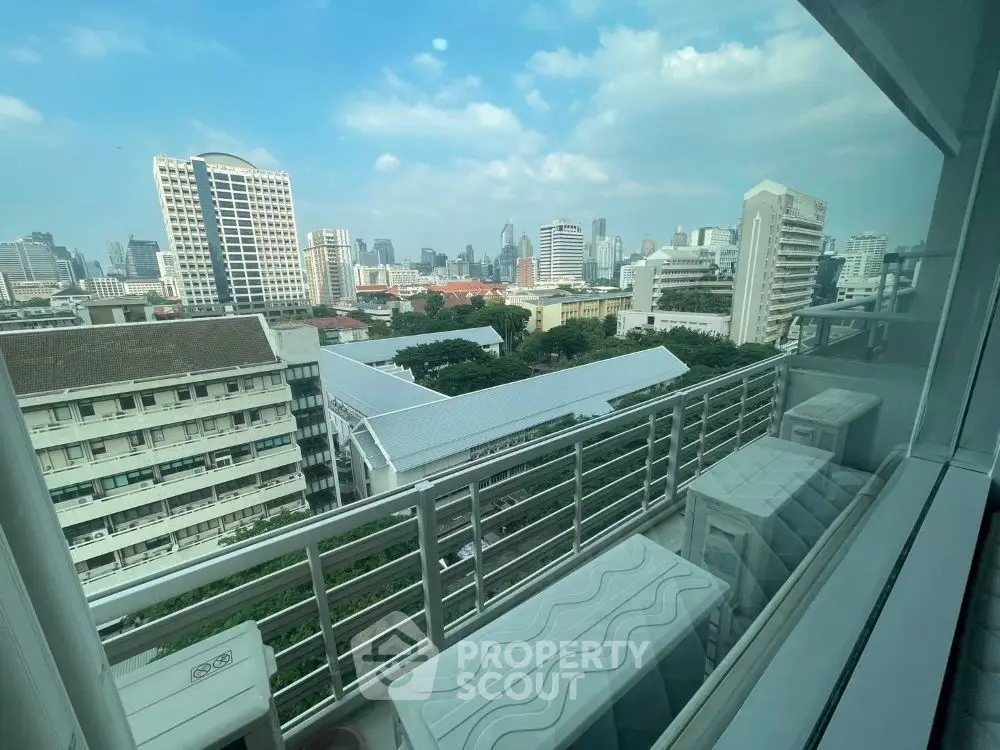 Stunning cityscape view from modern apartment balcony with skyline backdrop