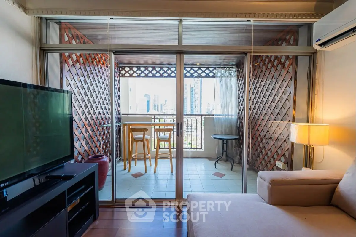 Stylish living room with balcony offering stunning city views