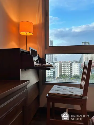 Cozy study nook with city view, perfect for productivity and relaxation.