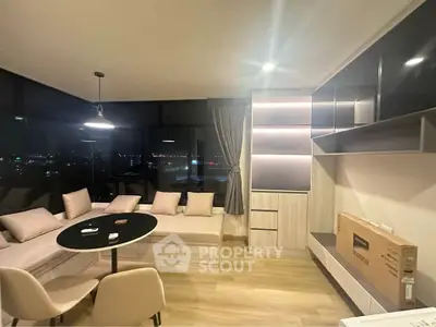 Modern living room with city view, stylish furniture, and ambient lighting