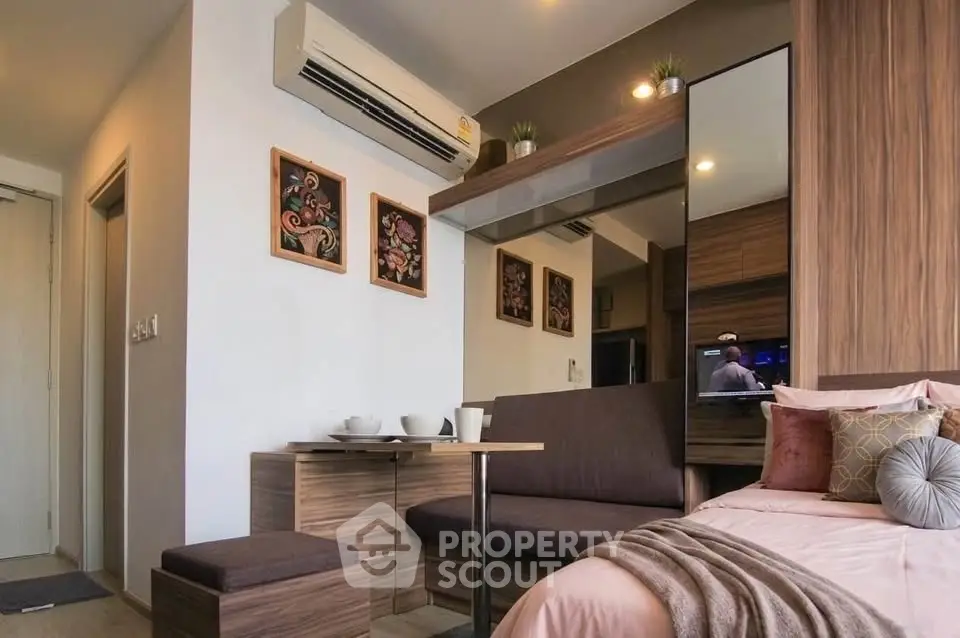 Modern studio apartment with cozy seating area and stylish decor
