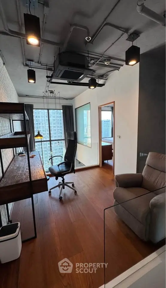 Modern study room with city view, featuring sleek desk, ergonomic chair, and stylish lighting.