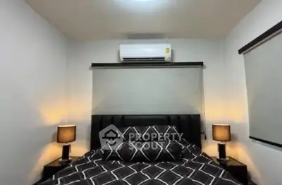 Cozy bedroom with modern decor and air conditioning, perfect for restful nights.