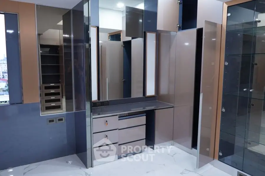 Modern storage room with sleek cabinets and glossy finishes