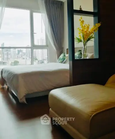 Cozy bedroom with city view and elegant decor