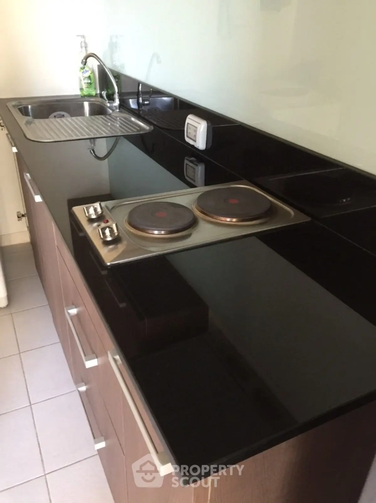 Modern kitchen with sleek black countertop and electric stove