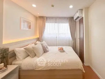 Cozy and modern bedroom with natural light and stylish decor, perfect for relaxation and comfort.